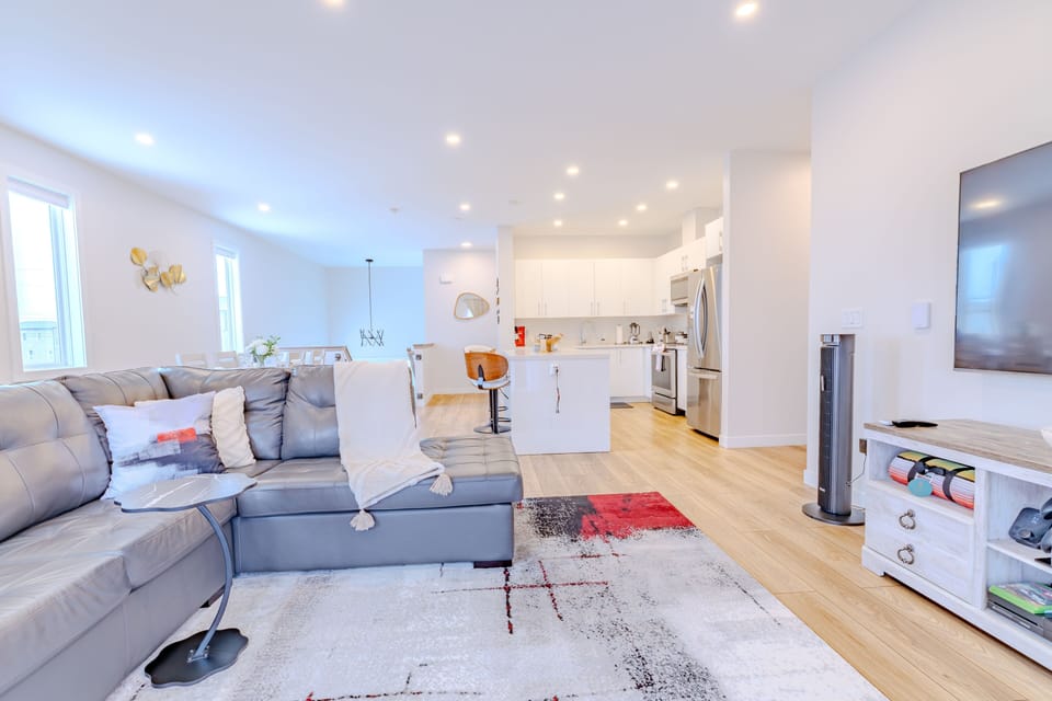 This short-term rental boasts an expansive living room, perfect for relaxation 