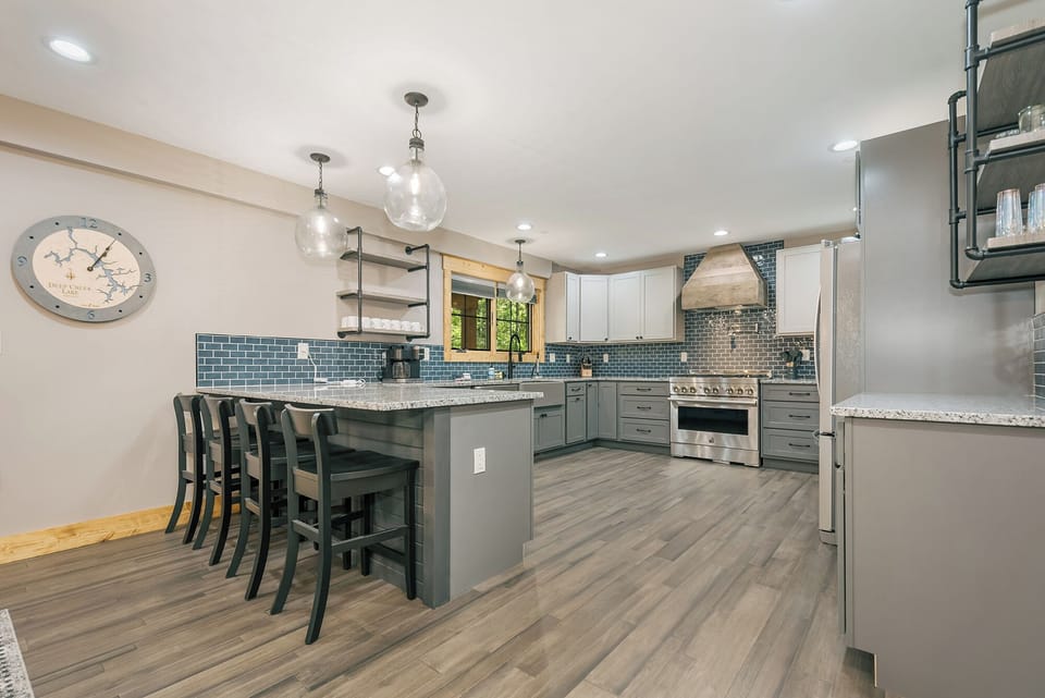 The kitchen is fully equipped and has seats for four at the breakfast bar.