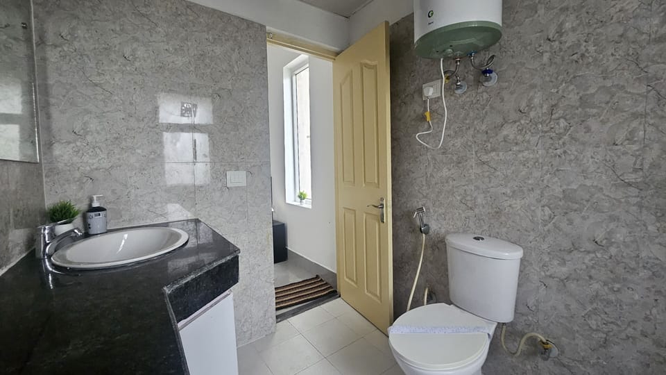 Shower, rainfall showerhead, towels, soap