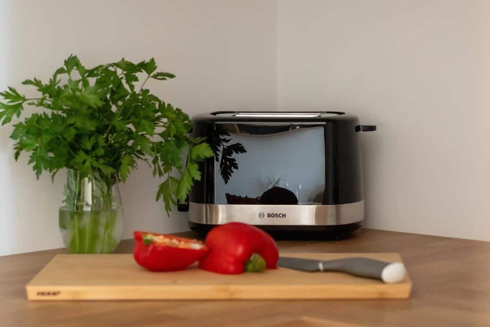 Kitchen corner with fresh vegetables and appliances