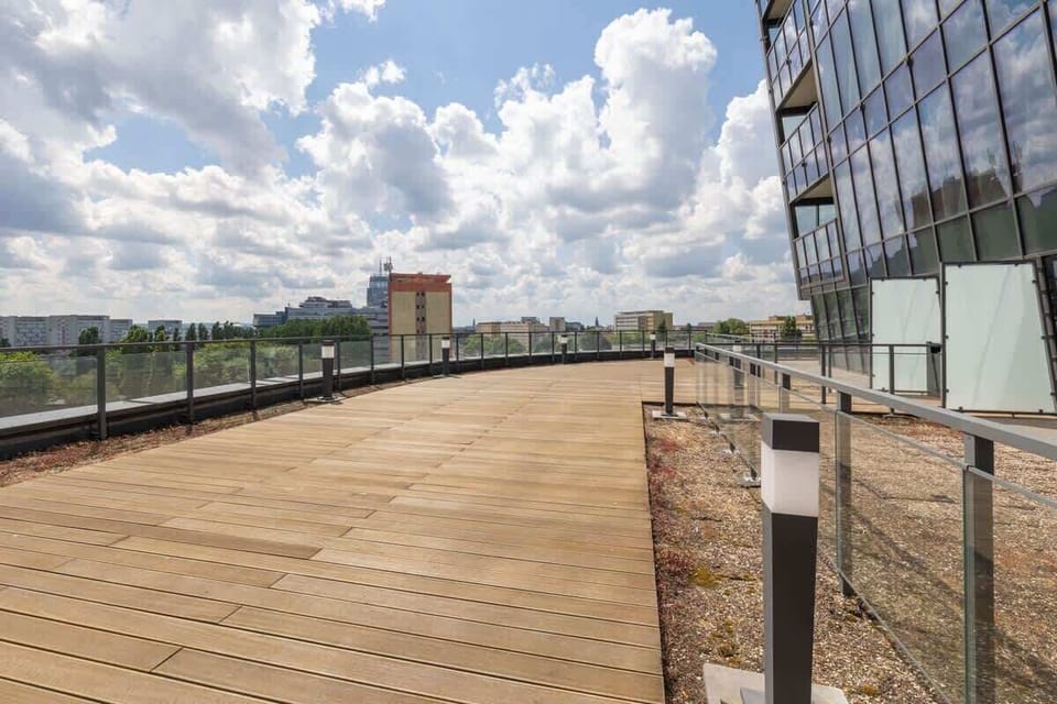 Enjoy open-air dining or sunsets on this beautifully arranged rooftop.

