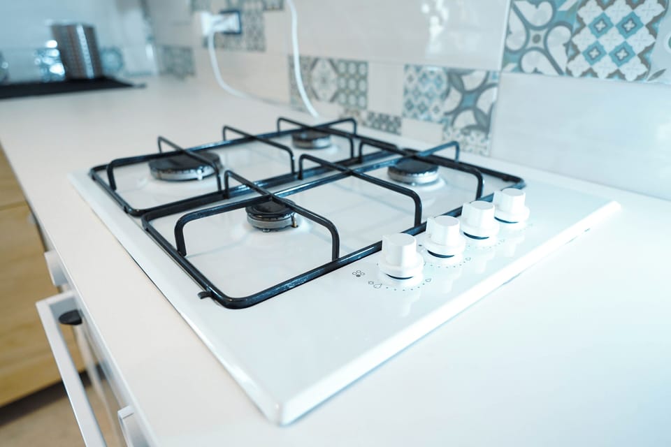 Mini-fridge, oven, stovetop, cookware/dishes/utensils