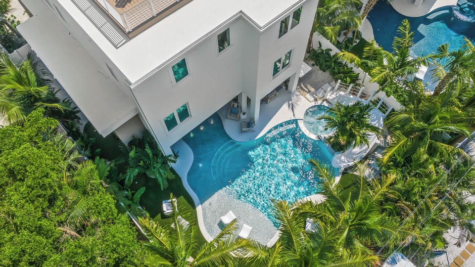 Daytime - Aerial - Resort Style Pool w/ Water Slide and Heated Spa