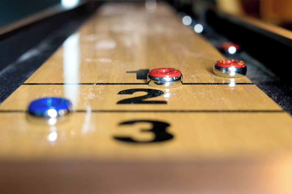 Enjoy the shuffleboard table in the game room!