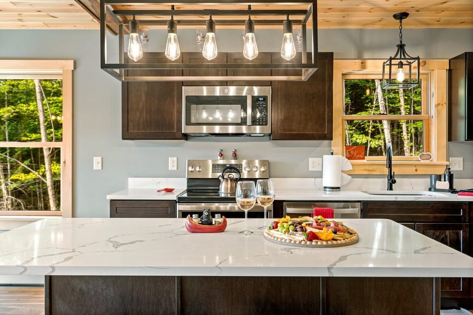 Savory meals and cozy chats happen at our convenient kitchen bar table.