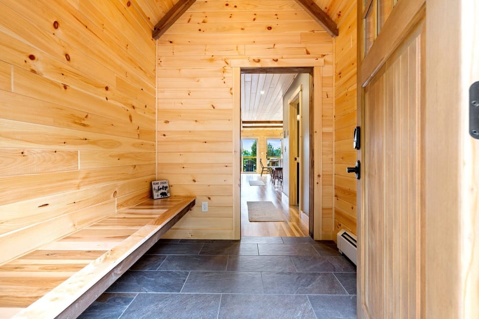 Step into our warm and inviting entryway, where your mountain escape begins.