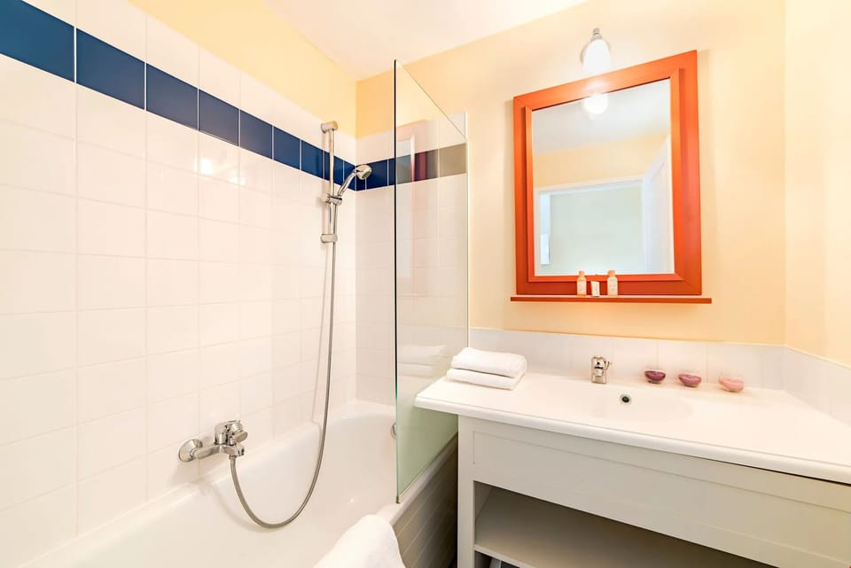 Get ready for the day in the bright bathroom.