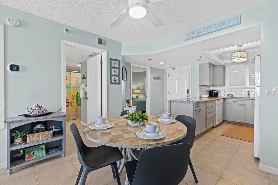 A cozy table for four in an open-plan layout, ideal for meals and family conversations.