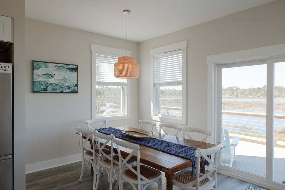 Large dining table with seating for up to 13 guests makes family dinners and group gatherings easy and memorable.