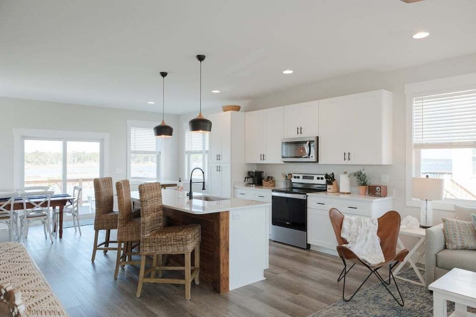 Bright and airy open-concept living space designed for gathering with family and friends after a day exploring Topsail Island.