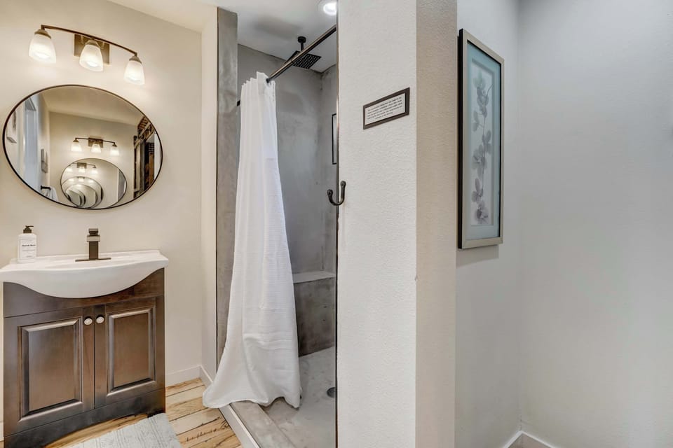 The master bathroom offers a blend of modern style and comfort for your daily routine.