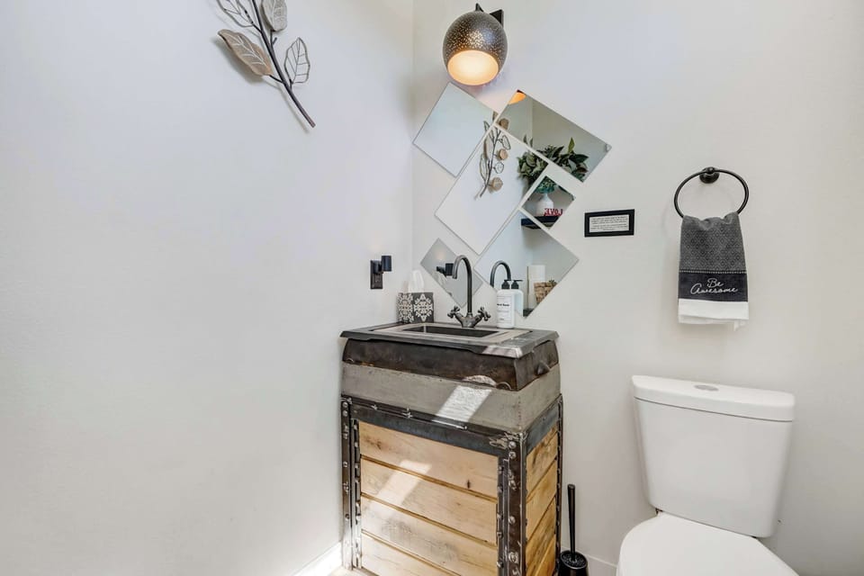 Convenient half bathroom located just off the living room.