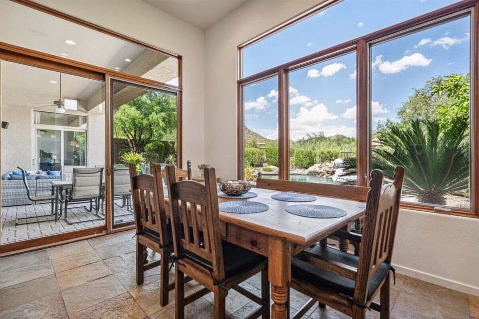 Dining table next to the kitchen that seats 6 guests.