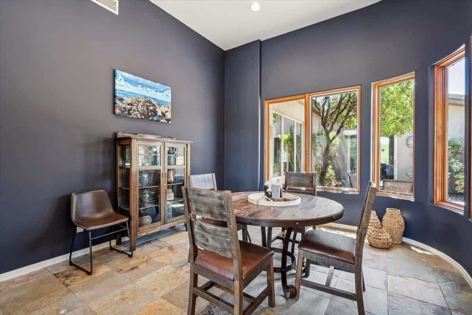 Dining table next to the living room that seats 4 guests.