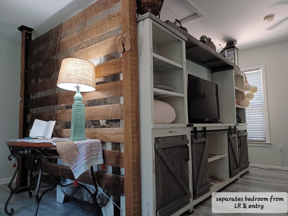 Entryway (To left; office cubby Right;Living area. Bed behind walls.