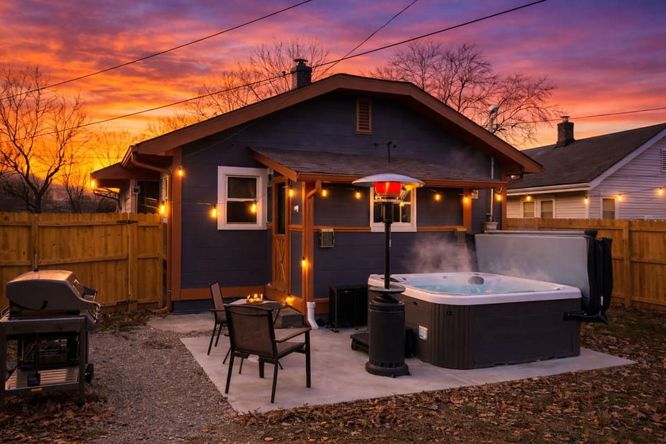 Private hot tub oasis with grill, heater & string-lit patio