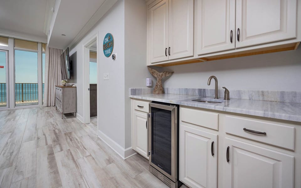 Grab a chilled bottle from the wine cooler or create your favorite cocktail at this elegant wet bar
