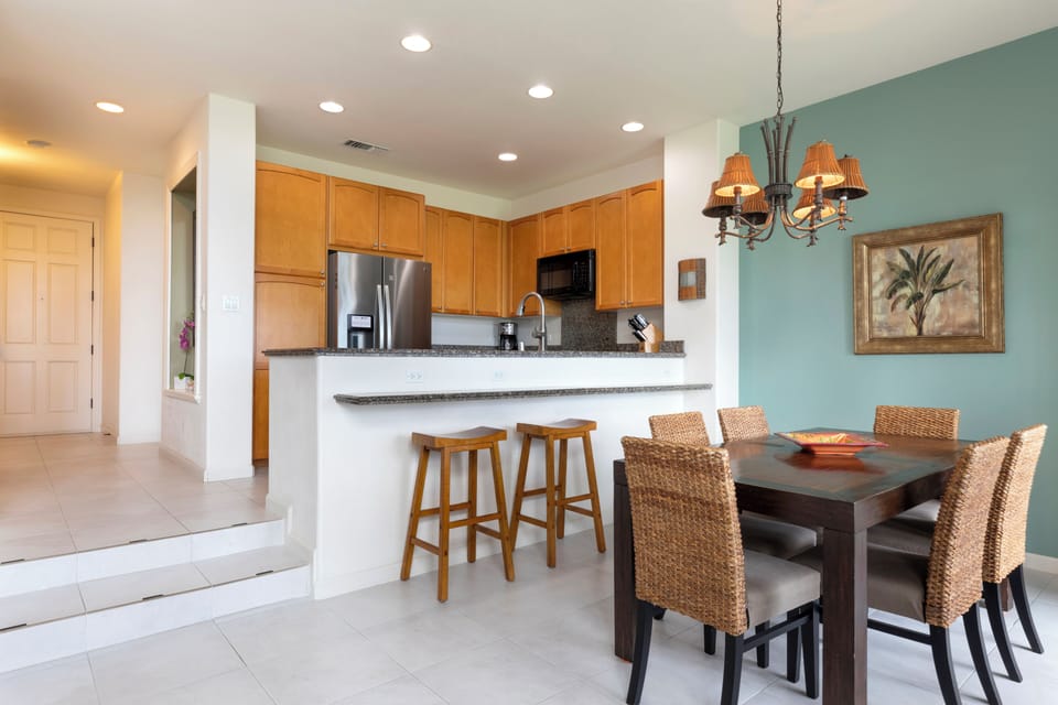 Dining area with seating for four and breakfast bar