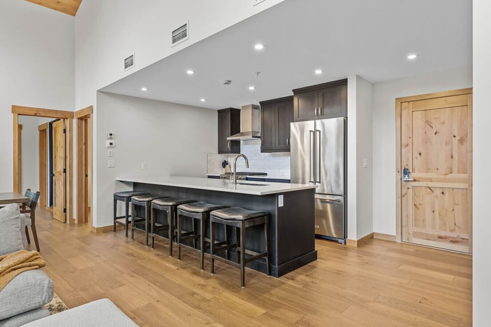Beautiful modern kitchen, fully stocked for cooking and ample seating to entertain