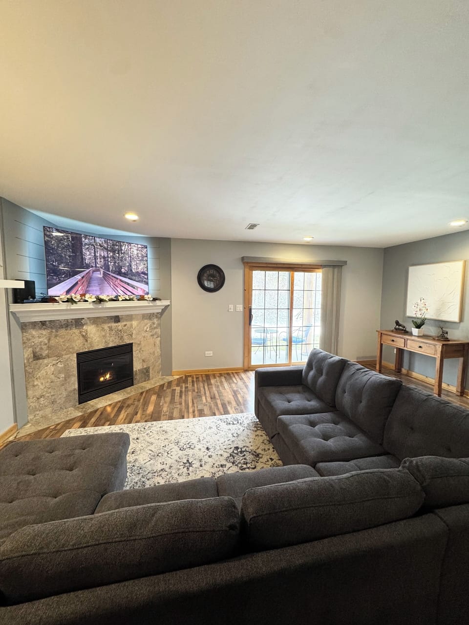 Living room with slide door patio seating to back yard