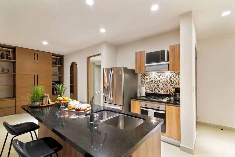 Enjoy the kitchen island—dine or relax with a stunning ocean view.