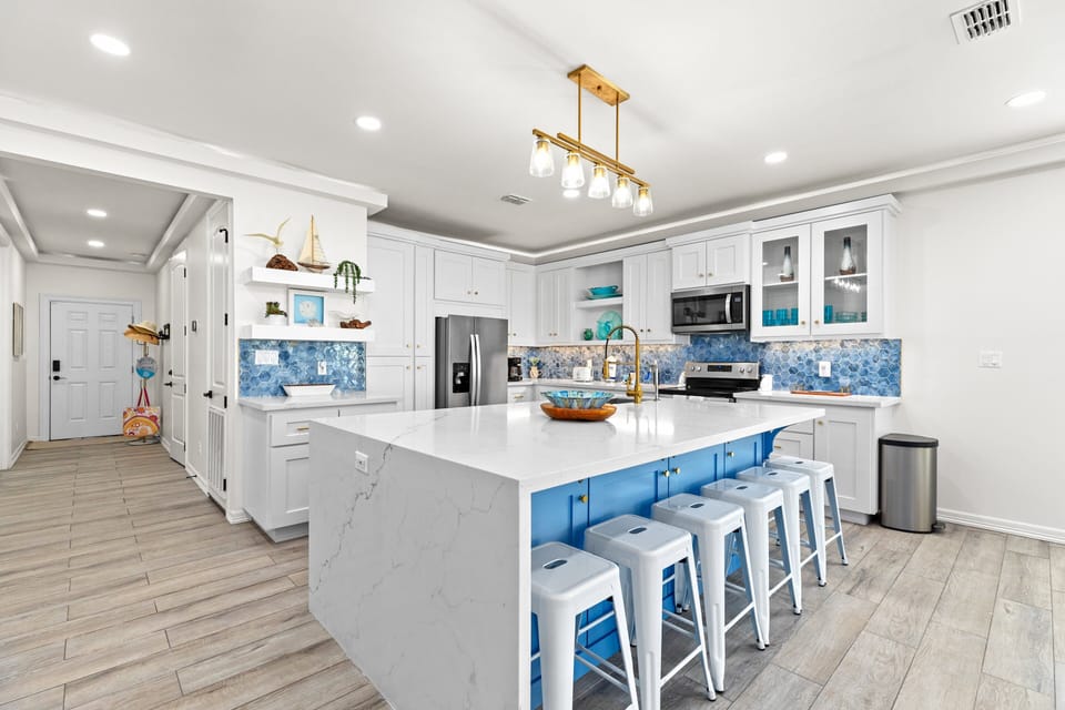 Gorgeous open concept kitchen equipped with stainless steel appliances & large center island.