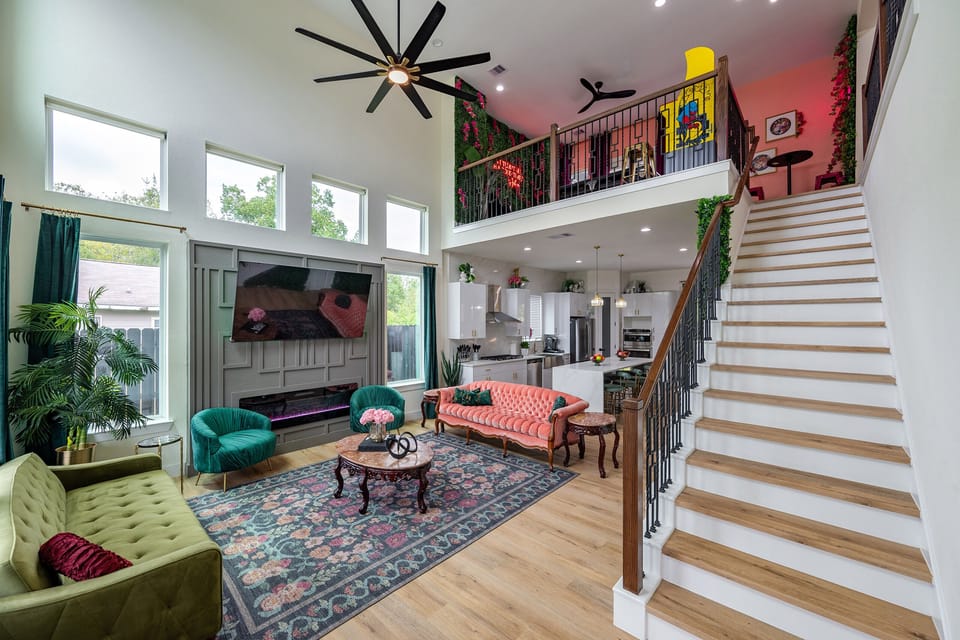 Living Room: Sleek design meets vibrant decor for lively gatherings in Houston's charming space!