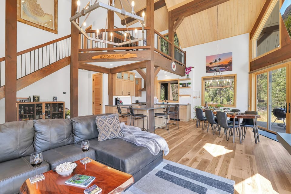 The open concept space is perfect for entertaining, including the loft space featuring two solid wood built-in bunks