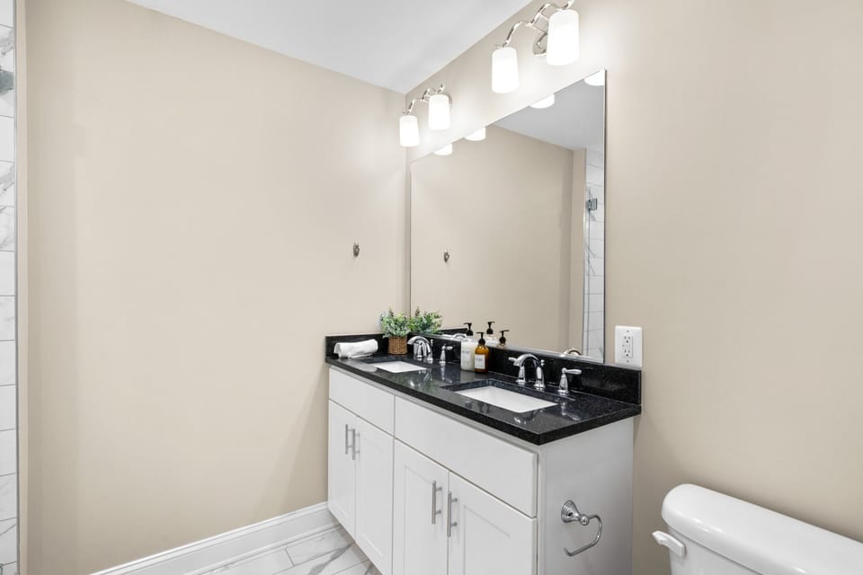 Master bathroom sink located upstairs. Toilet also has bidet.