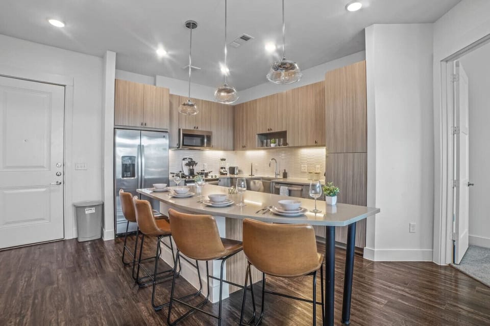 Set the table for memorable meals in this beautifully arranged dining area. With elegant place settings and a charming centerpiece, it's perfect for hosting dinner parties or enjoying family dinners in a cozy and stylish atmosphere.