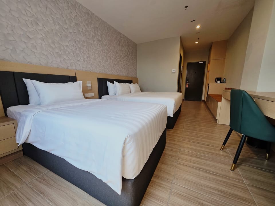 Deluxe Triple Room, Non Smoking | In-room safe, desk, laptop workspace, blackout drapes