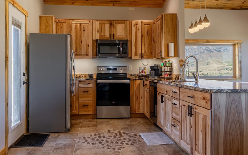 Fully equipped kitchen with modern appliances and ample counter space, ideal for preparing home-cooked meals during your stay.