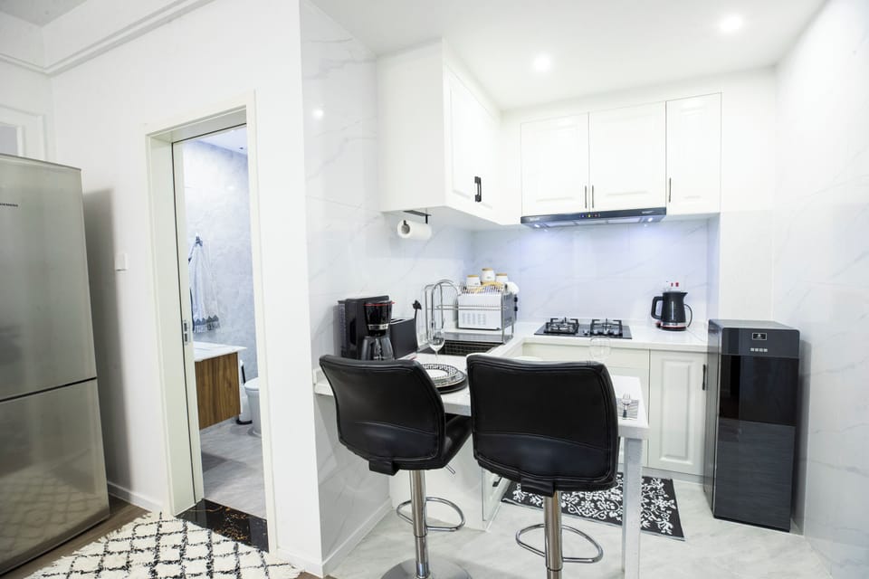Deluxe Apartment, 1 King Bed, Kitchen, City View | Bathroom | Slippers