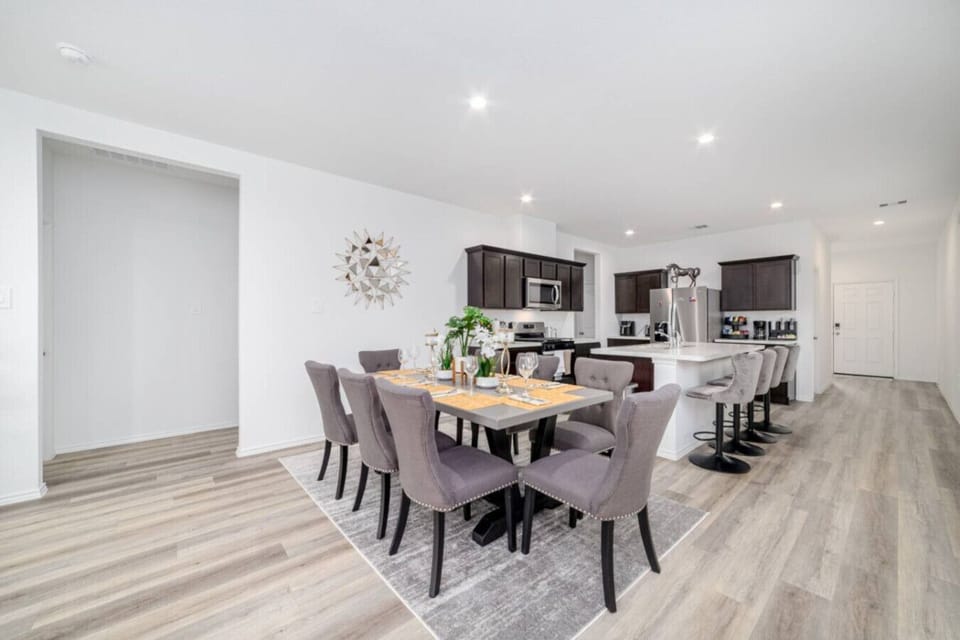 Inviting dining room with ample seating, ideal for enjoying meals and gatherings.
