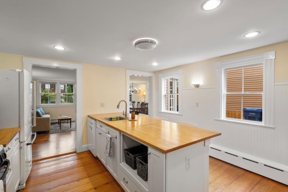 The kitchen off the living room features a spacious meal prep island.