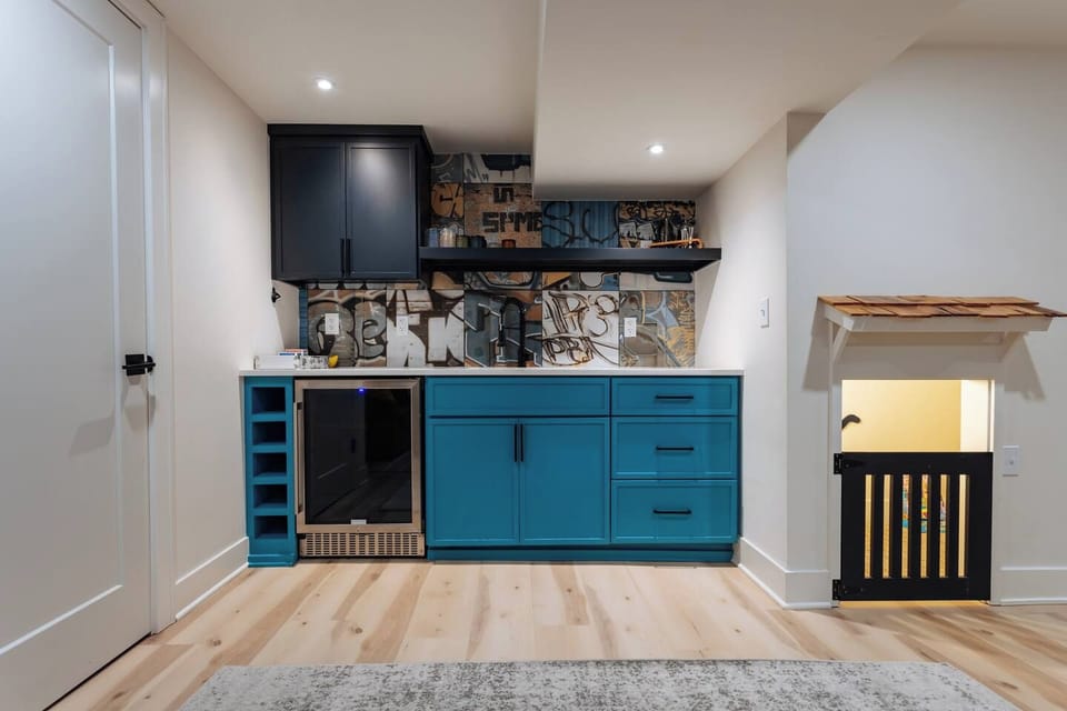Mix up drinks at the stylish wet bar! Up next is the secret play room...