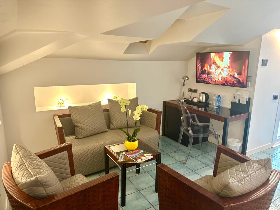 Junior Room, 2 Queen Beds, Hot Tub, Partial Sea View | Minibar, in-room safe, desk, soundproofing