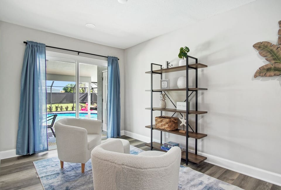 Chic poolside nook with modern chairs and a view of the patio