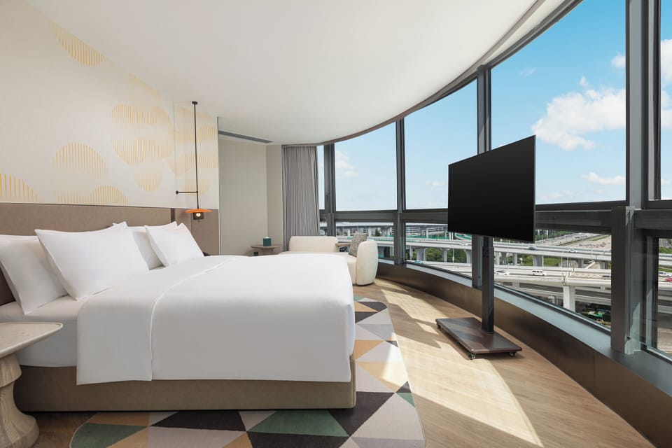 Suite, 1 Bedroom, Garden View | Down comforters, in-room safe, blackout drapes, soundproofing