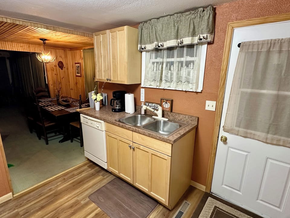 All the comforts of home, a dish washer & drip coffee maker, grinder, & coffee.