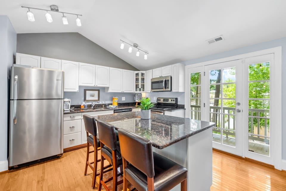 Access to the deck right off the kitchen so you can enjoy sunrise views with your coffee. 