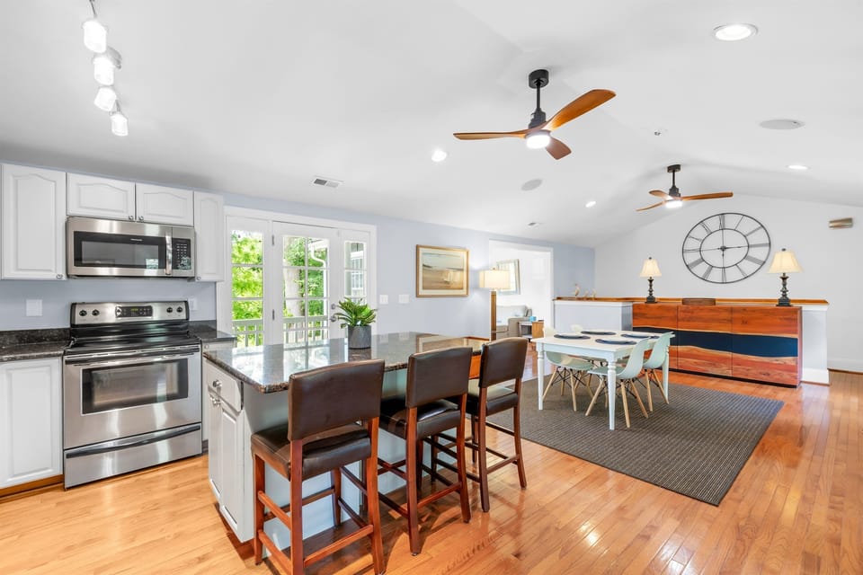 Fully stocked kitchen complete with modern appliances and cookware. 
