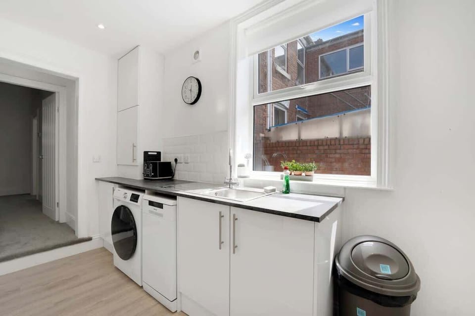 Family-friendly kitchen oasis equipped with all essentials, including a washer & dryer, oven, fridge and full cookware set.