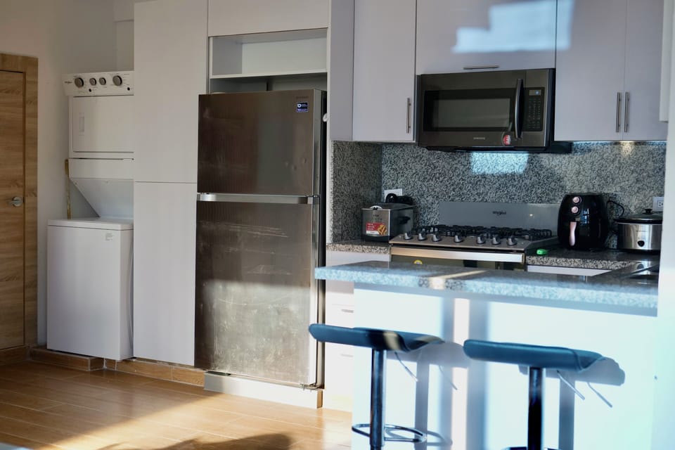 Deluxe Studio, Beach View | Private kitchen | Full-size fridge, microwave, oven, stovetop