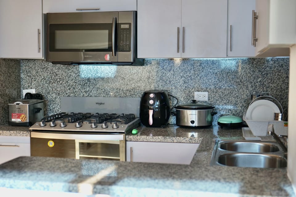 Deluxe Studio, Beach View | Private kitchen | Full-size fridge, microwave, oven, stovetop