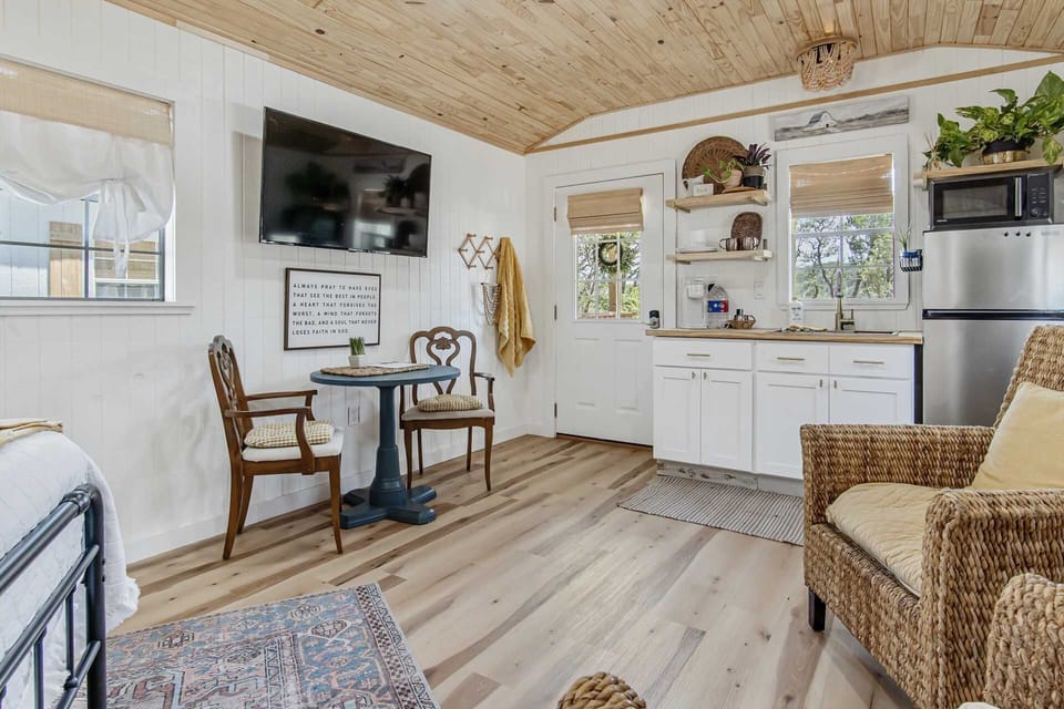 A cozy dining nook rests right under a Roku-ready smart TV, which is positioned to be visible from anywhere in the cabin's common area! Wifi is also free to use throughout the property.