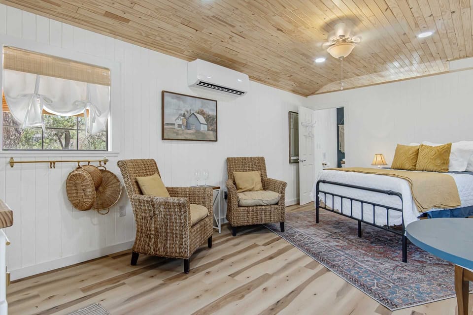 The bright interior of the Starlight Cabin is highlighted by a leg-stretching living area, and a roomy and restful queen-sized bed. Ask us about our rollaway bed option for a third guest!