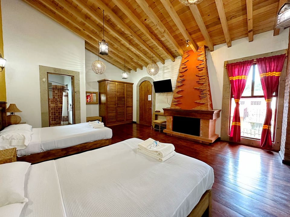 Deluxe Quadruple Room, Courtyard View | Desk, laptop workspace, iron/ironing board, free WiFi