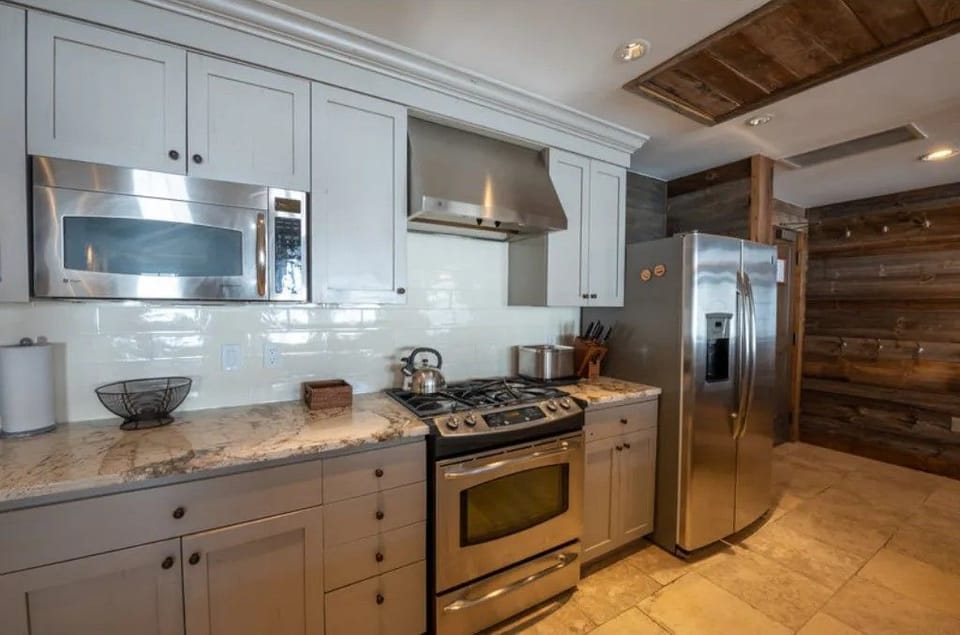 Fully-equipped kitchen with modern appliances and ample counter space.