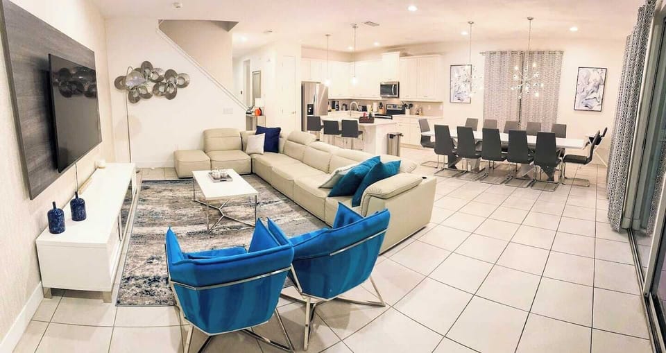 🛋️ Elegant Living Room Retreat! Bright, modern, and inviting — this open-concept space features plush seating, designer décor, and pool views for the perfect blend of comfort and style.